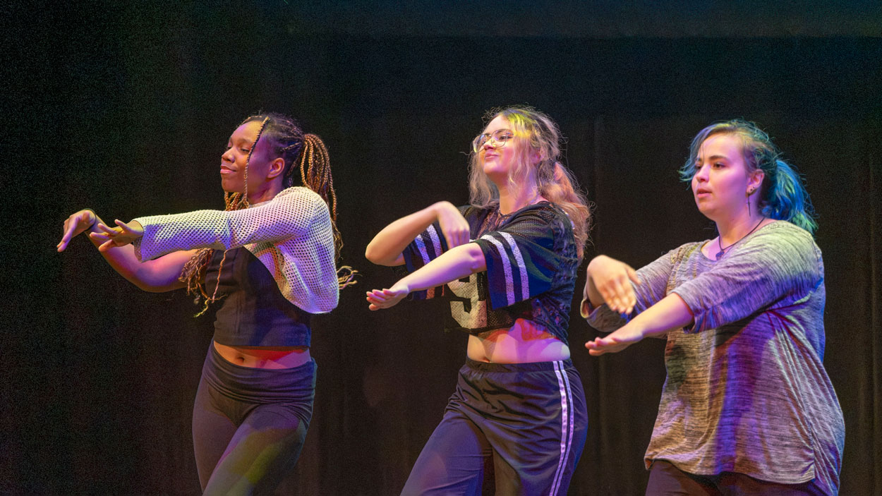 Members of the University of Missouri–St. Louis KHAOS K-Pop dance group perform during World Languages Day held inside the Touhill Performing Arts Center. Information about KHAOS can be found on Triton Connect and their Instagram account khaos.dance.group.