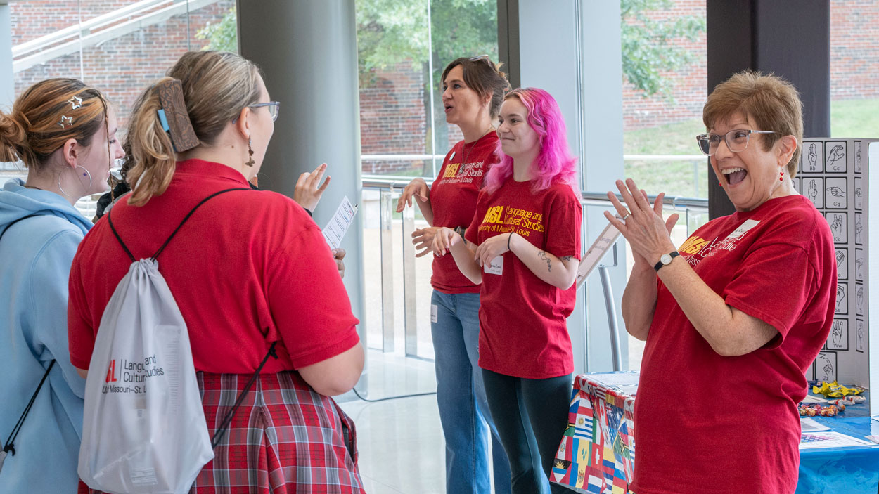 Left to right, ASL students, Lacey Jacobs, Grace Lewis and Cindy Russell, teach high school students some American Sign Language. UMSL Department of Language and Cultural Studies held World Languages Day Celebration on Friday September 25. The event drew students from high schools across the St. Louis region. UMSL students, faculty and staff helped students with students took part in a scavenger hunt in their target language that encouraged them to explore campus. Meanwhile, others stopped to chat with representatives from the College of Arts and Sciences, the International Business Program, Pierre Laclede Honors College and UMSL Global. However, the day’s biggest attractions were the numerous game and activity tables set up throughout the Touhill lobby.