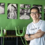 UMSL alum Xin Wei, owner of Corner 17, stands in the restaurant's dining room
