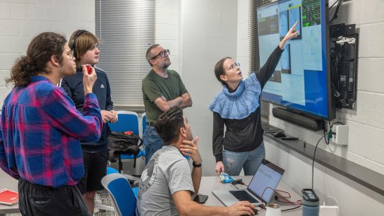 UMSL physics faculty and students