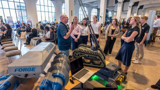 A representative from the US Air Force talks to students