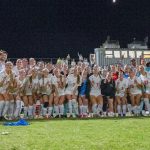 UMSL's women's soccer team celebrating the GLVC regular-season title