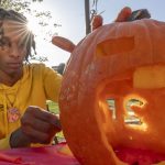 Josiah Lockhart covering a pumpkin
