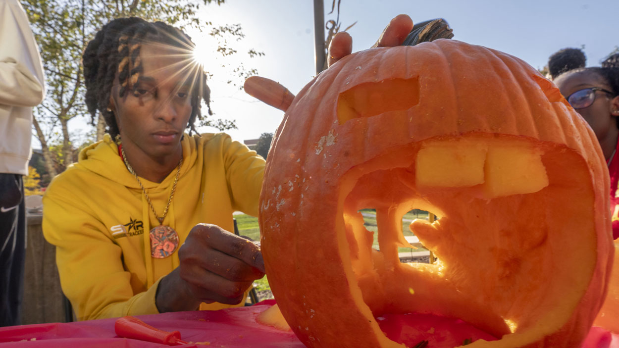 Josiah Lockhart covering a pumpkin