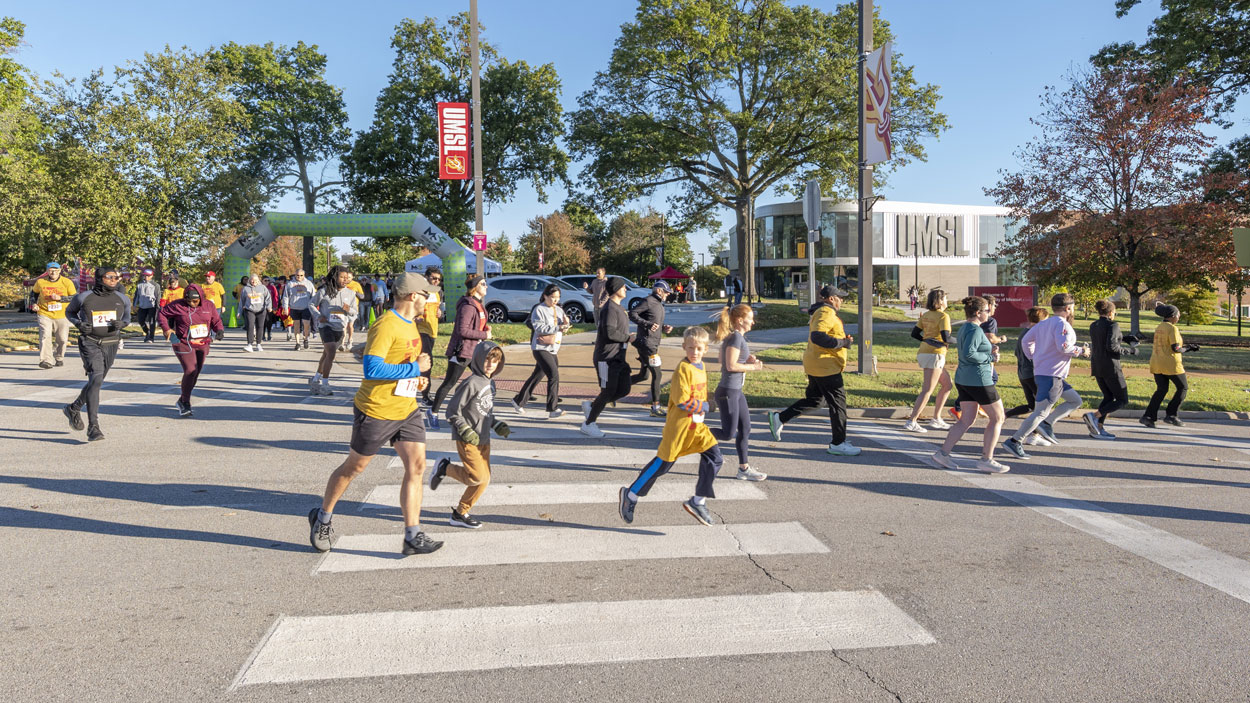 Runners set out from Alumni Circle and turn onto Grobman Drive at the start of the sixth annual UMSL 5K Run/Walk.